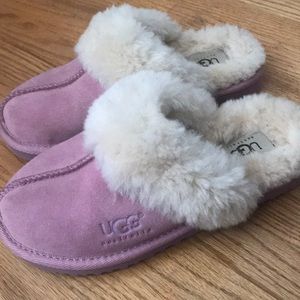 A pair of pink UGG slippers